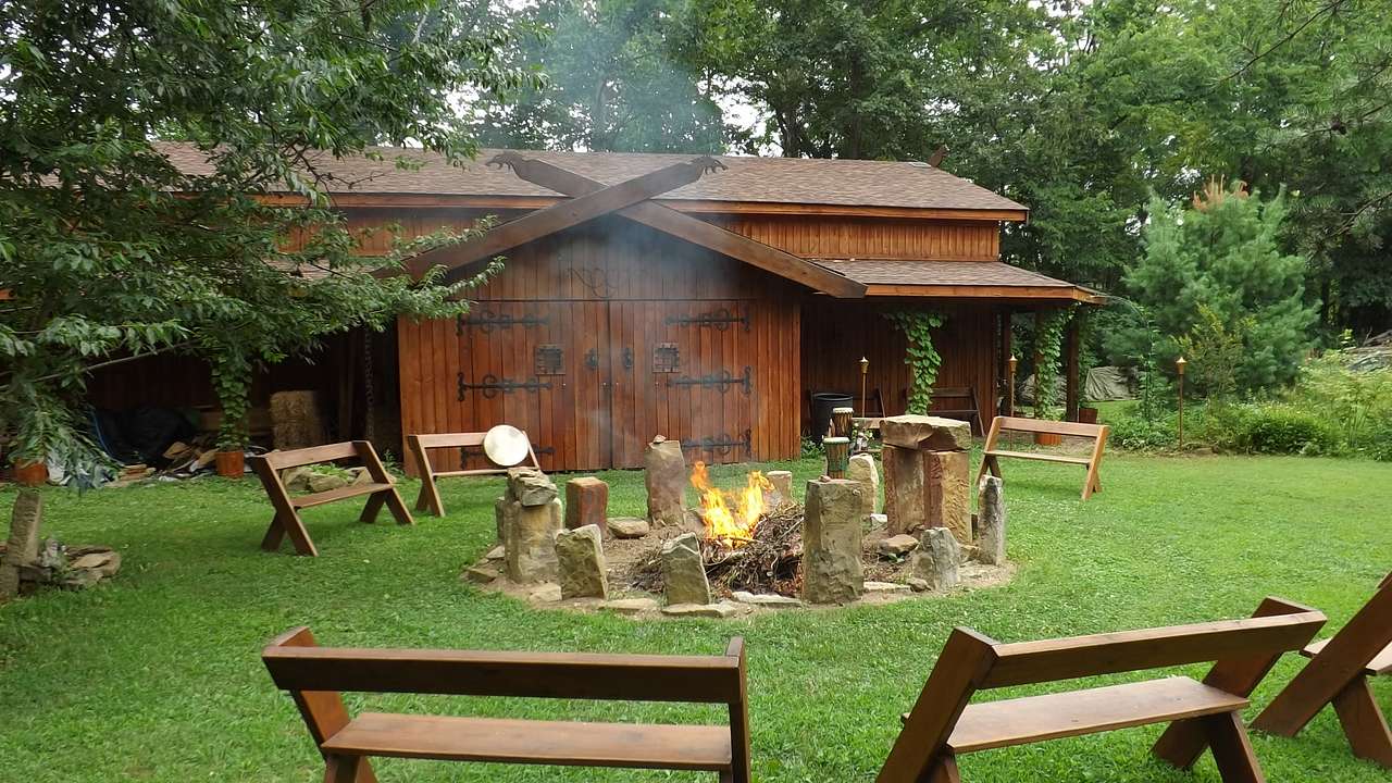 The main longhall building and communal fire pit.