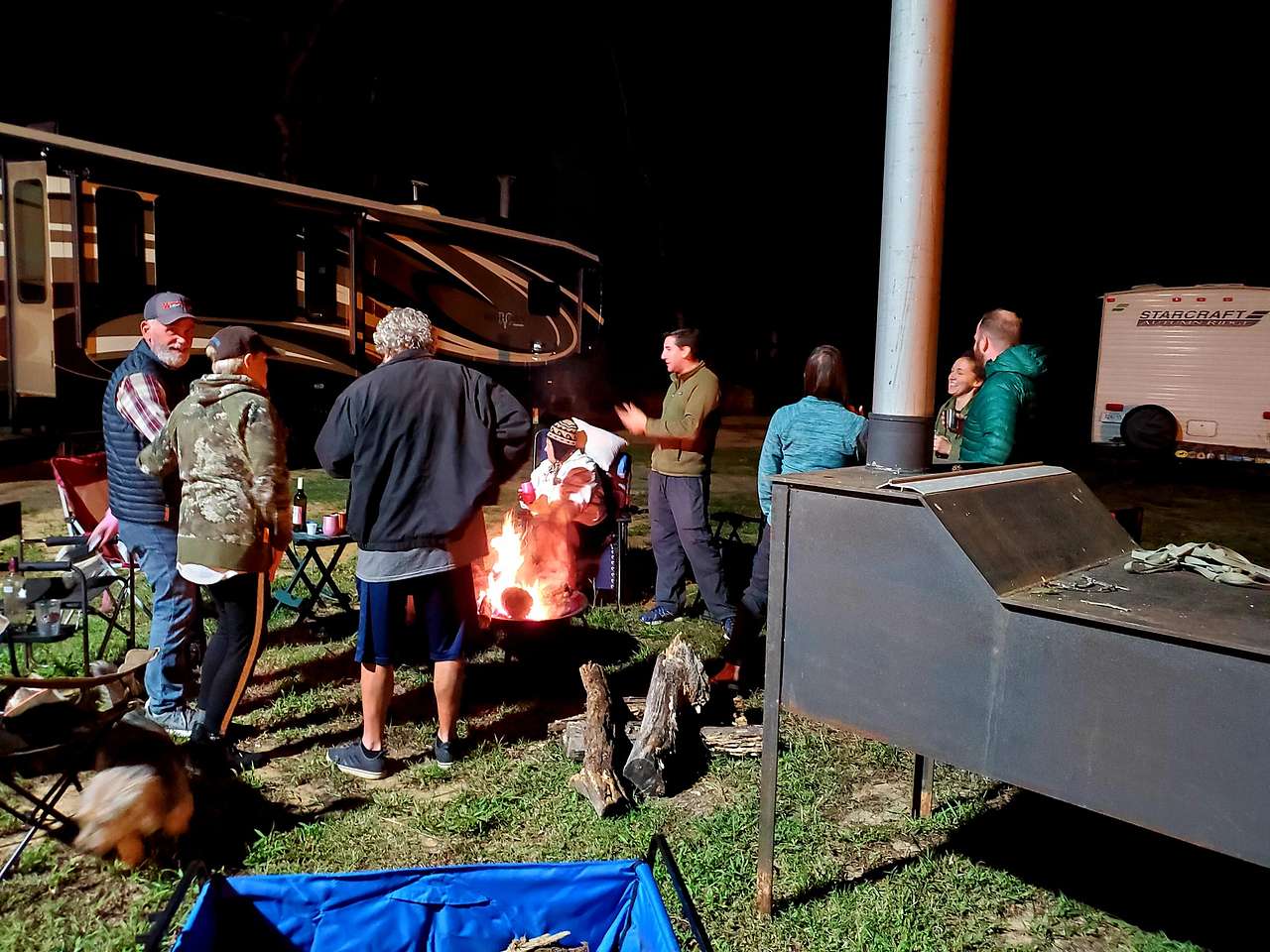 Campers enjoying our fire pit on a cold evening.