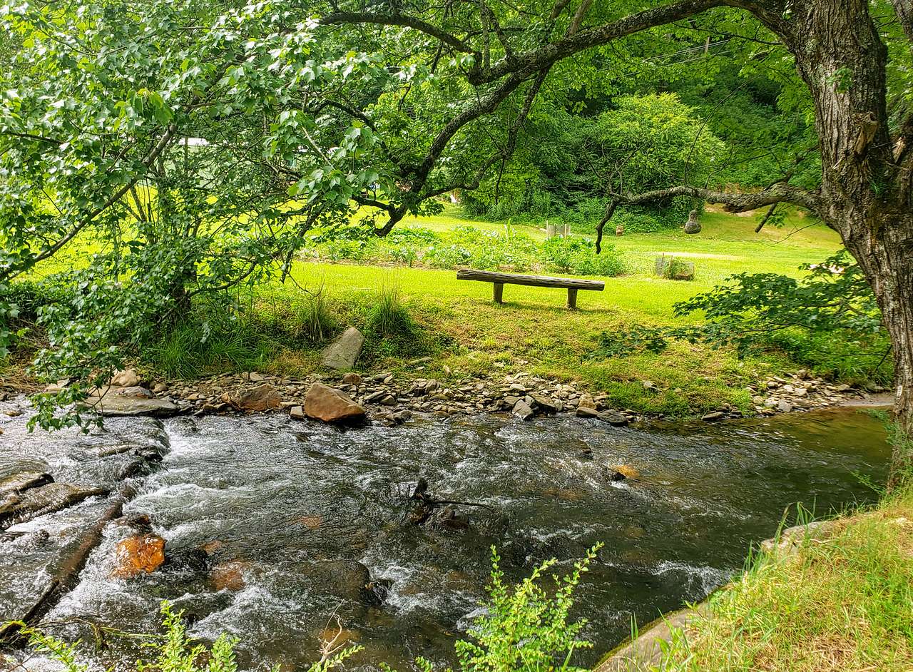 Walk across our bridge for additional benches, fire pits, outdoor lawn games and hammocks for relaxing. 