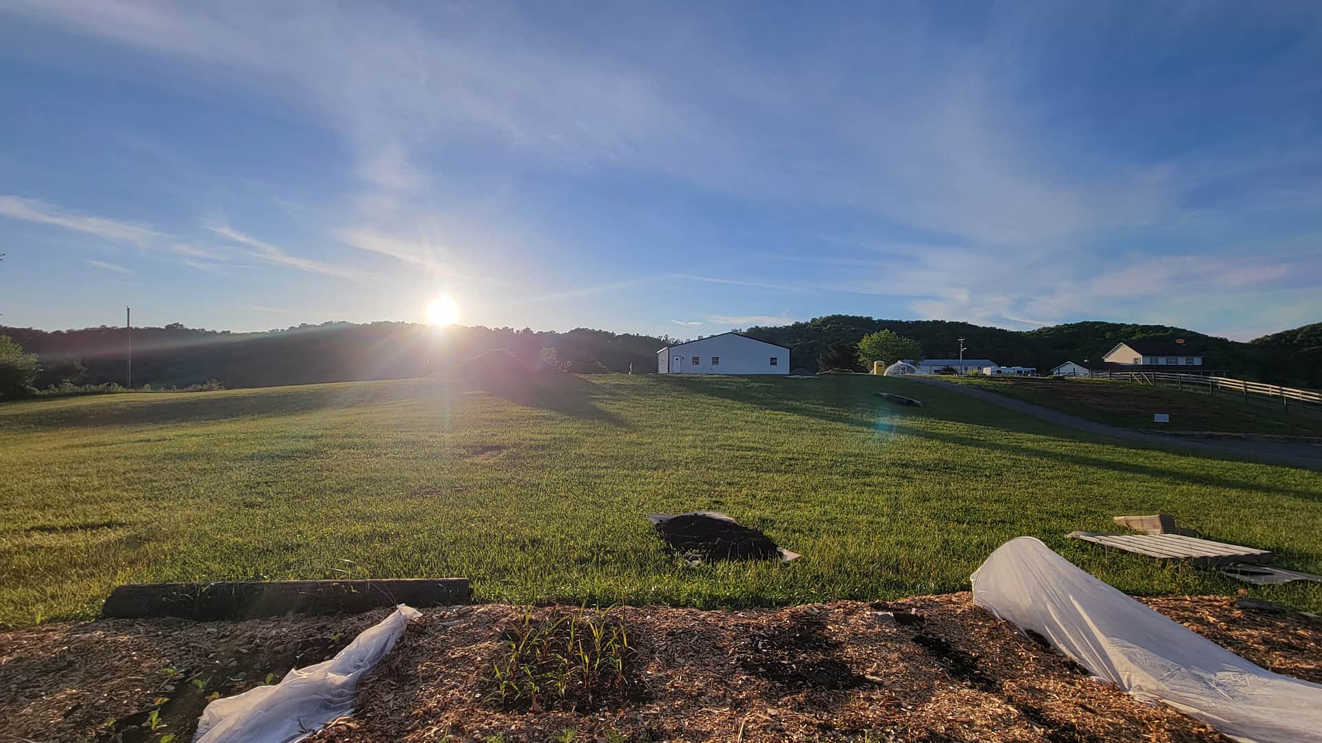 RV & Trailer Parking between pick-your-own garden (foreground) and white Farm Building.