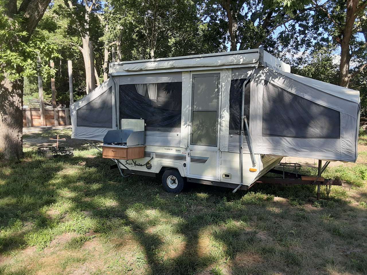 Shady pop-up camper, available during the warm season.