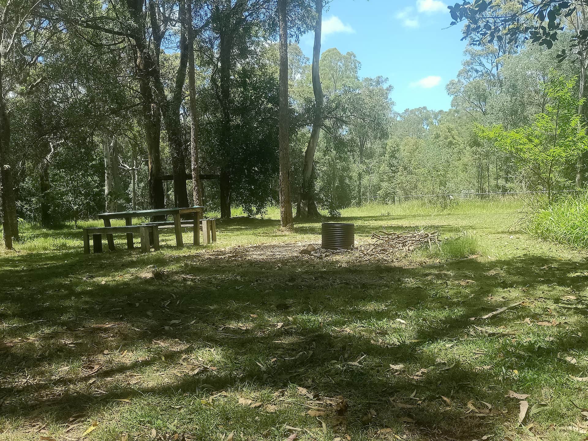 This site has a gravel circle with fire pit to sit around on cushions or chairs at the fire. There is a picnic table and Slackline and a few different sites in part shade to choose from 