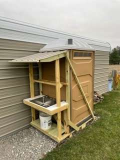 Portable restroom located at other spot 50' away