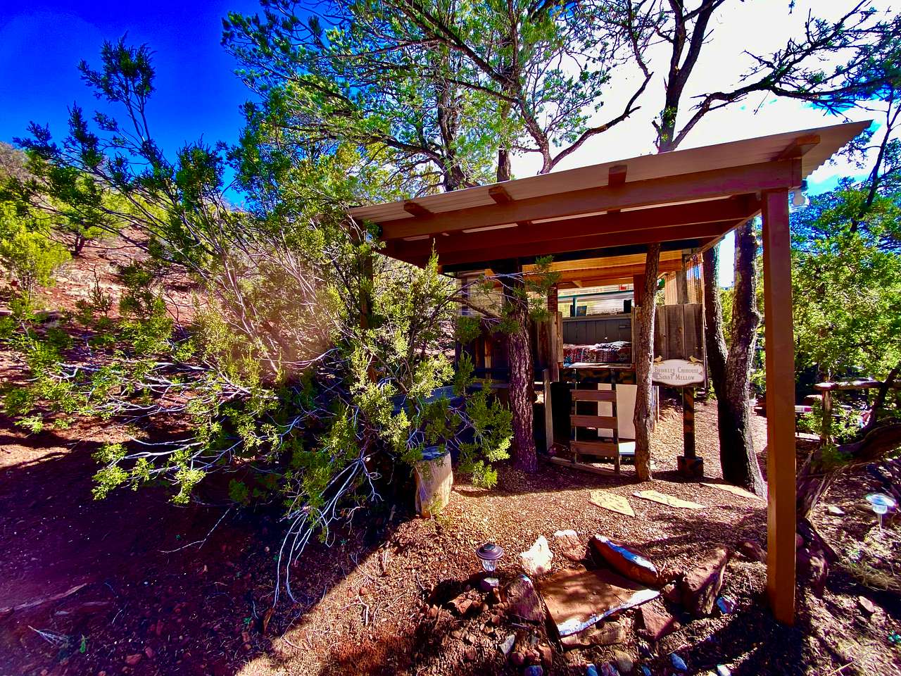 New Awning Over Front of The Chi-Treehouse! Around the back is the Kitchen, Dining, Fire Pit, Sunning Lounge, New BBQ, Bridge to the Private Outdoor Shower and Bath... And Just a 10 Second Walk over the bridge!