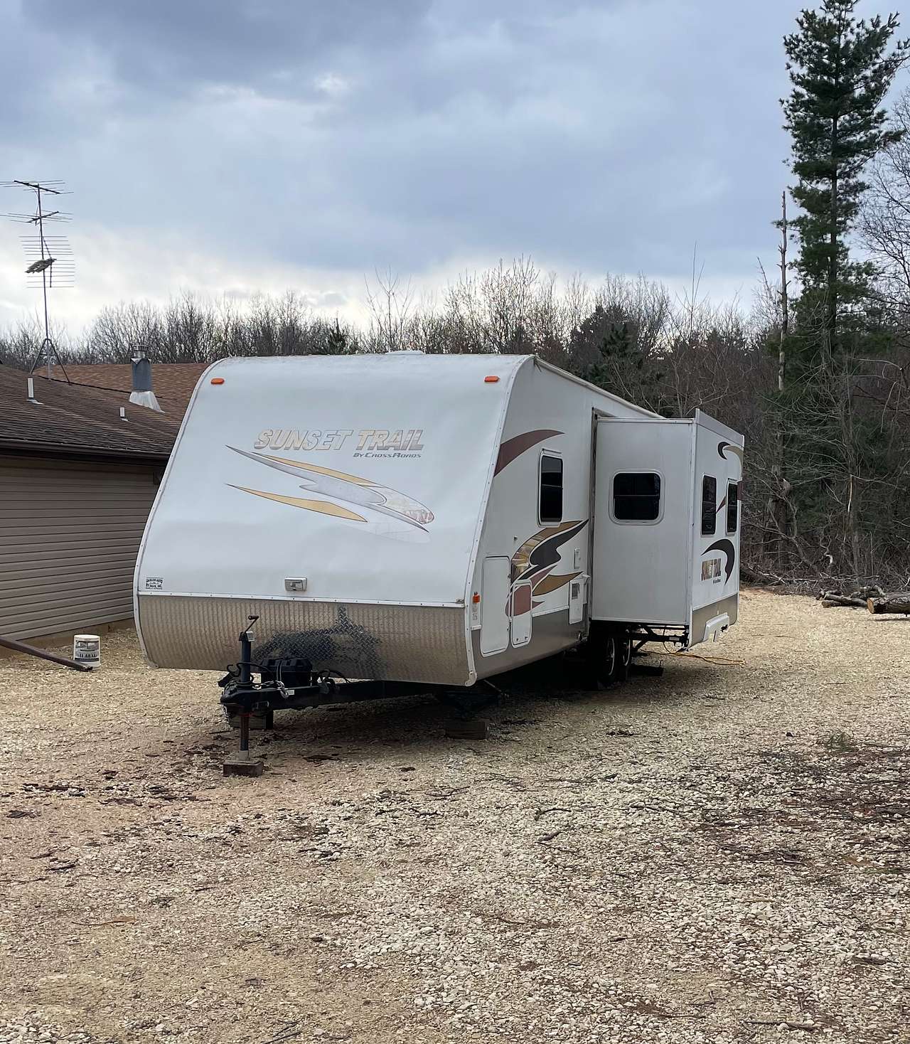 Sunset Camper with slide out open, parked next to the Manor House. This unit is not parked on the campsite in this picture. 