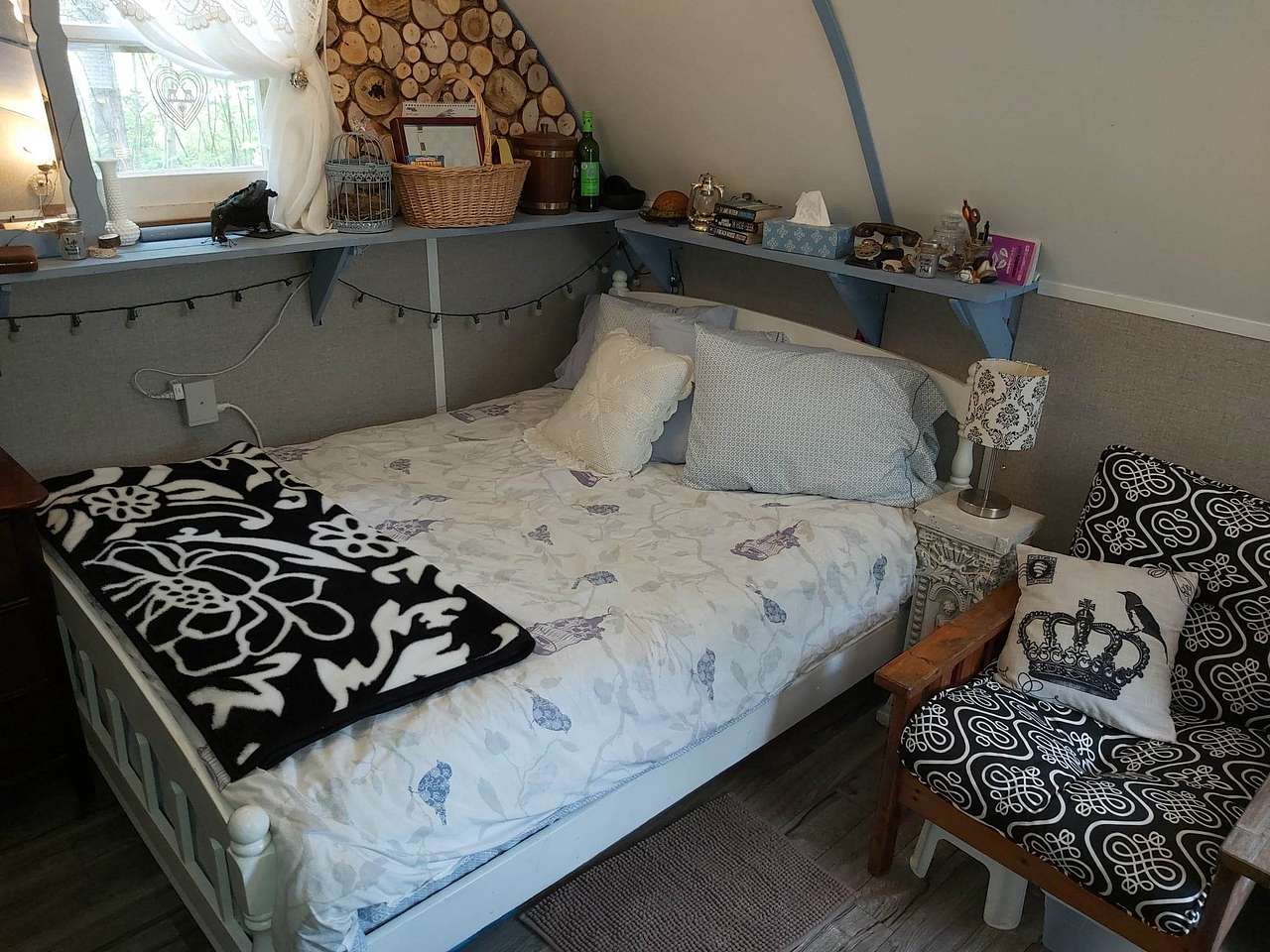 Have a lovely sleep in this comfy double bed with fresh bedding on it.  Relax in the big chair and read a book.