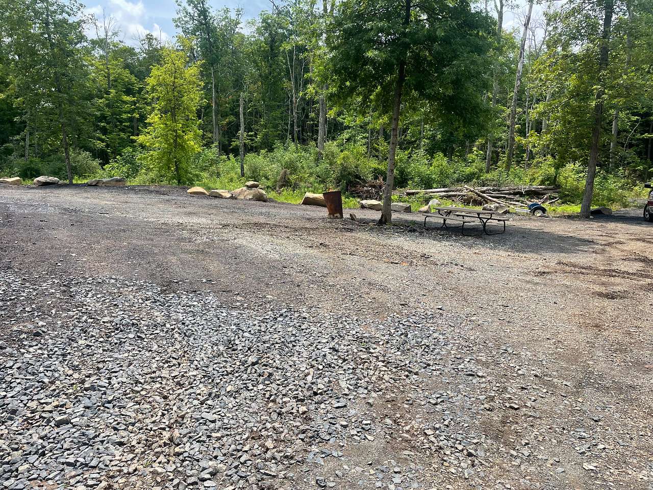 This is the RV site, ez in and ez out, NO backing needed , optional electric is available, all the trails are a short walk from here (please know it is up hill from here)
