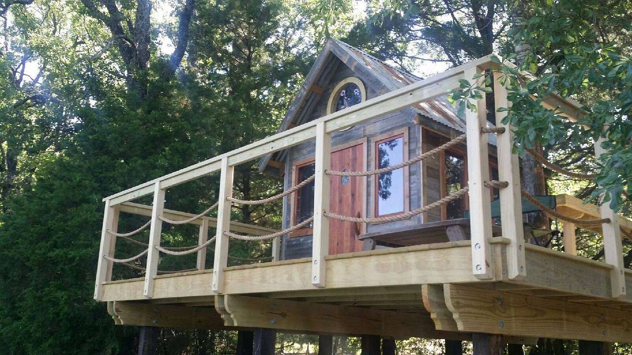 The charming Hummingbird Tree House sleeps two adults and two small kids in the loft. Handcrafted on an elevated deck overlooking a scenic pond in the middle of a forest- this romantic getaway is perfect for for creating great memories.   
