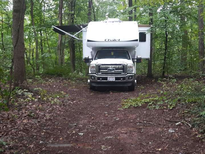 Site 2 On the Edge! Back in off the road. This site accommodates camping units to approximately 25-30 ft. 