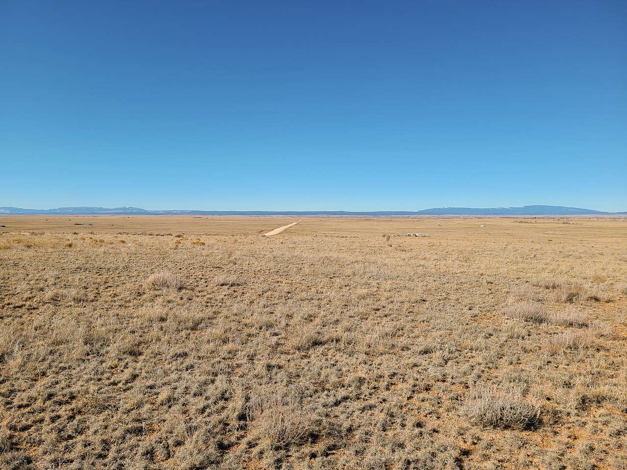 Well-maintained and wide county road in,  located just off I-40 and historic Route 66.