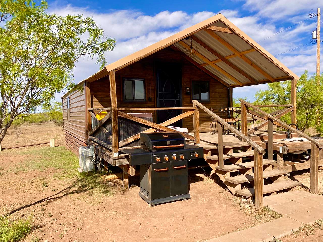RRR Deluxe Cabin Offers its own private porch, large gas grill, outdoor sink and prep space. Dinning set for 4 and outdoor sectional sofa for relaxing. Star viewing with made better with telescope provided. Need to keep movin'- no worries you will find a slew of outdoor games including a regulation size corn-hole set.