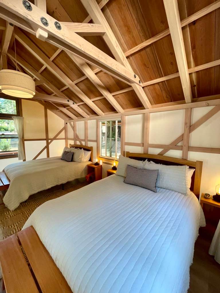 Cabin 6 has two luxurious queen beds with heated bed pads, cozy bedding, stunning woodwork, electricity and even a heater for the cold nights. 