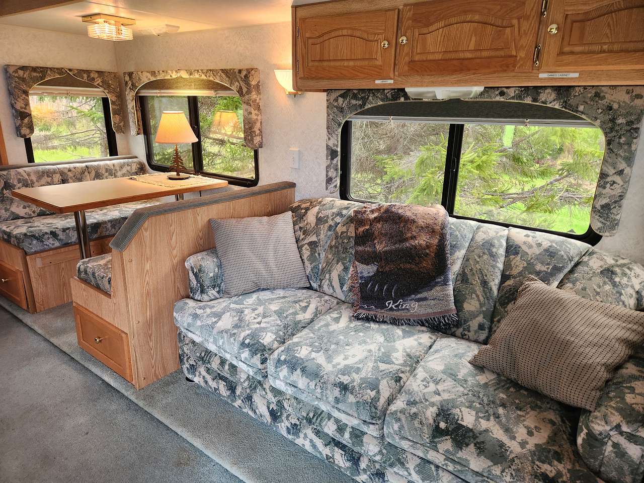 Living/Dining Area - the couch does not fold out to make a 2nd bed however the dinette can be converted to a 2nd bed if requested.

There is a JVC sound system CD Player as well as a 20" TV/DVD Player Combo.

A selection of reading material as well as board games etc is provided
