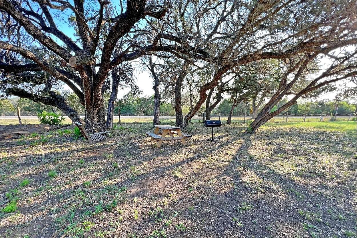 Camp Site one has a picnic table, BBQ pit, Fire Ring and a swing in the tree.