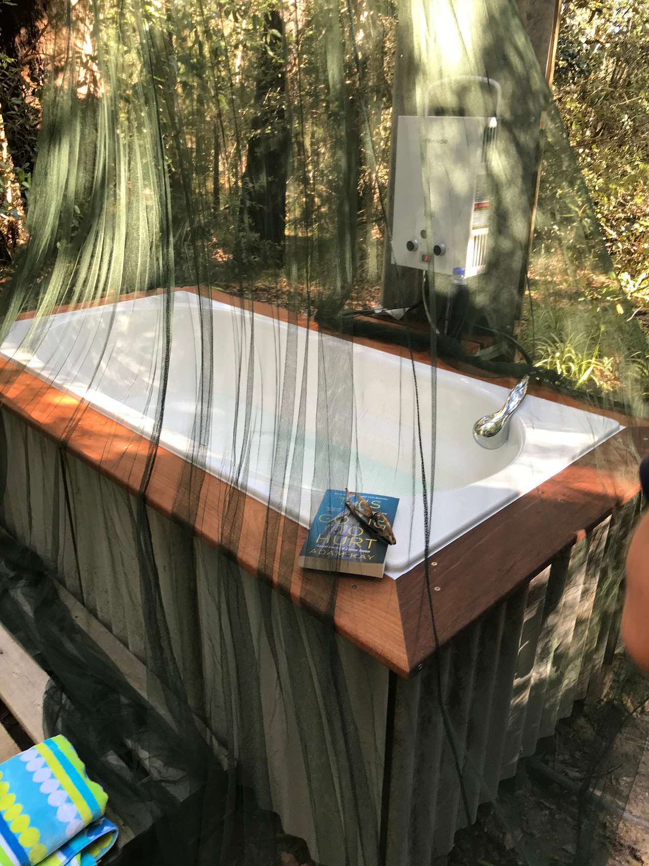 Picture yourself in a warm outdoor bath with a glass of your favourite drink in one hand and a book in the other surrounded by the gentle rustling of leaves and the soothing sounds of birdsong.