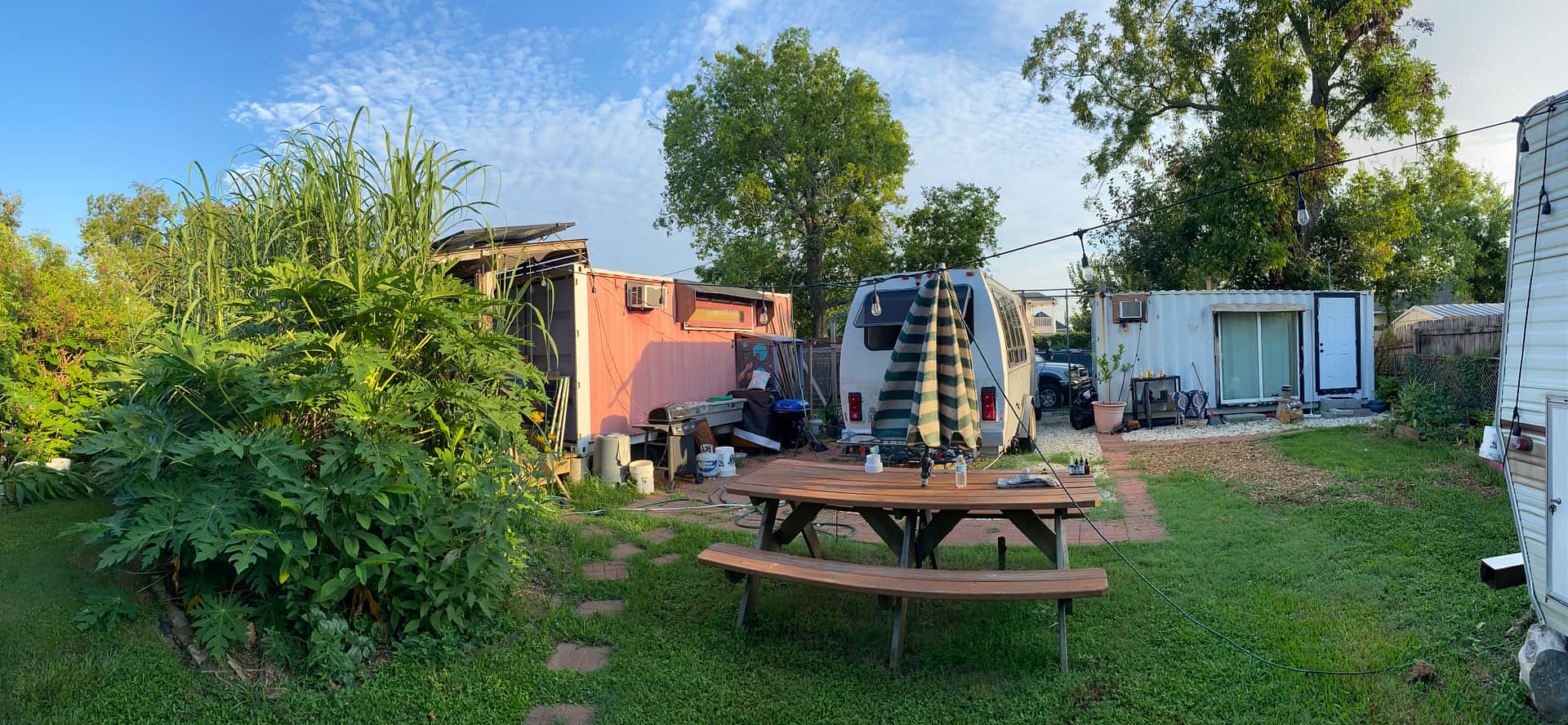 RV site showing van camper and picnic table