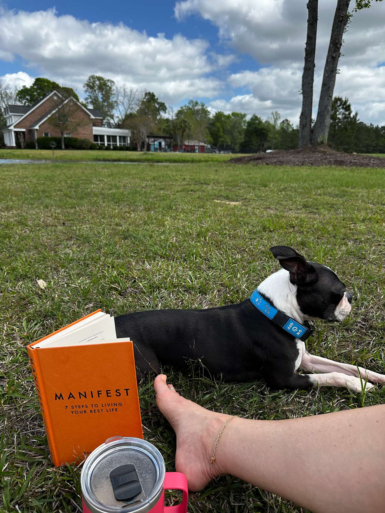 Turbo and I reading and relaxing while the guy fishes 