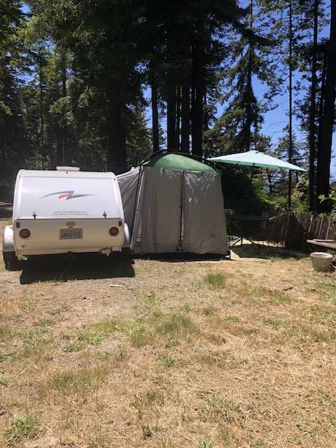 The little guy trailer, outer tent and table with chairs.