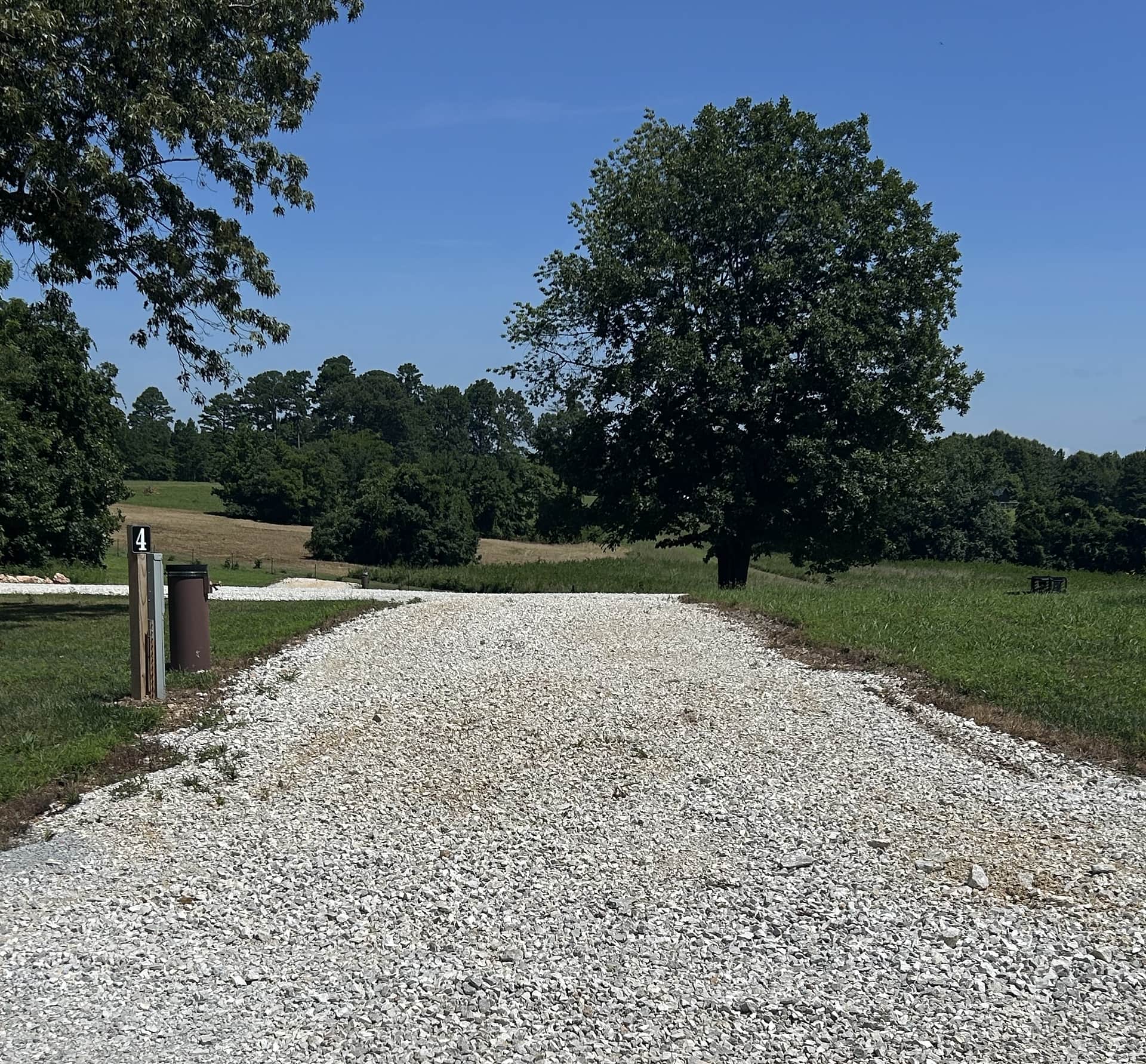 View of Site #4 - it is a pull-through with full hookups. Site length is approximately 90' in length.