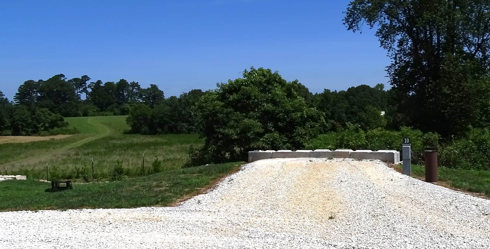 View of Site #10 - it is a back-in site, approximately 40 feet in length, with water/electric only.  50/30/20 amp service is available. We are the only campground in the area that provides potable water.