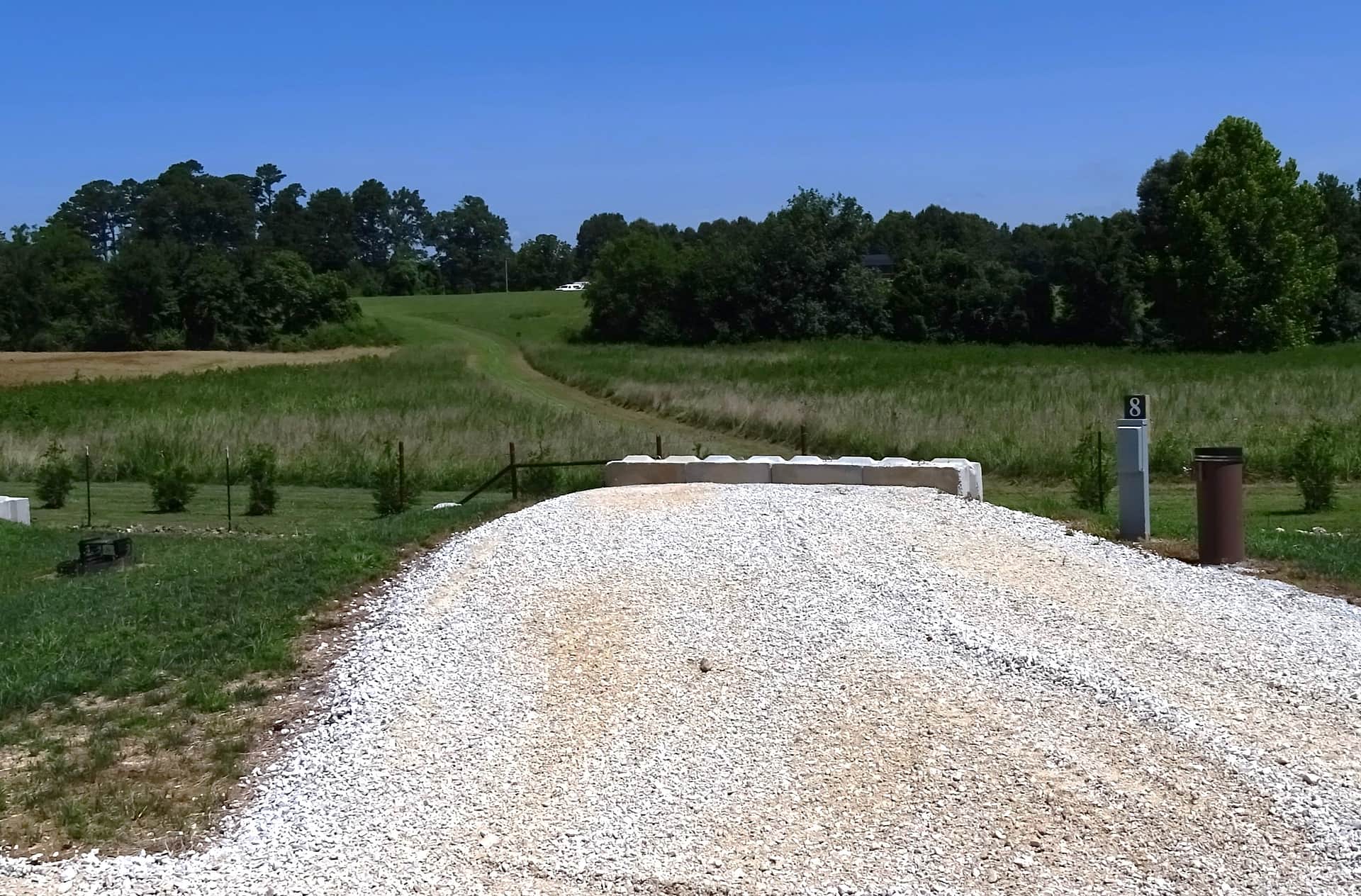 View of Site #8 - it is a back-in spot, approximately 45 feet in length, water/electric only. 50/30/20 amp service is available. We are the only campground in the area that provides potable water.