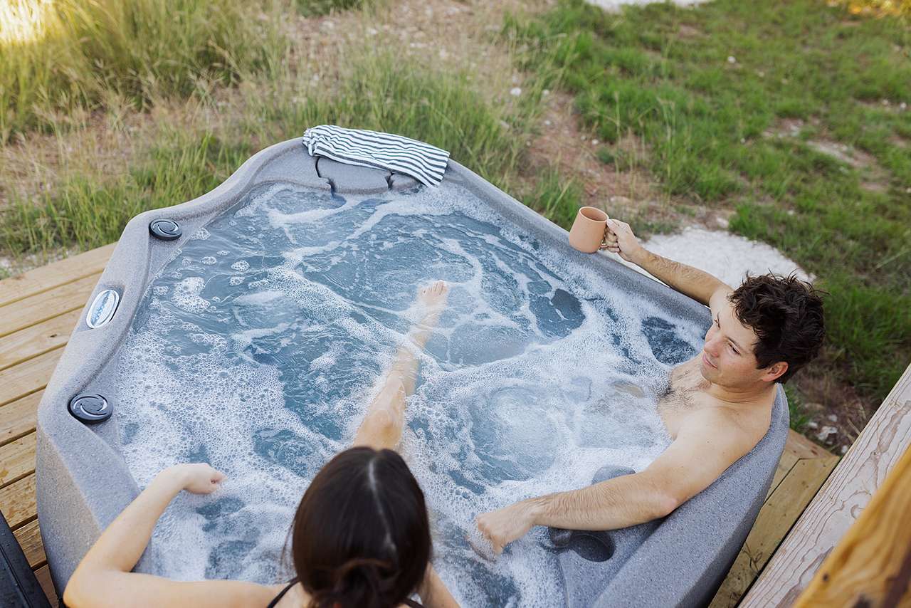 Private hot tub for two is perfect for watching the wild life walk by and stare at the stars at night.