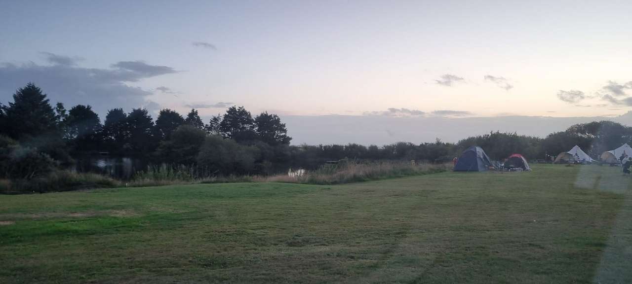 View across camping ground to fishing lake