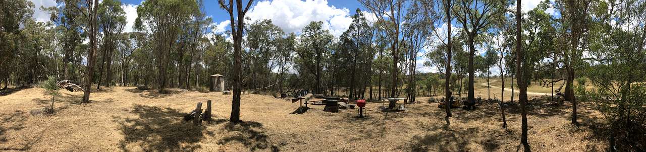 Serenity on the Rocks campground - a panorama photograph. Driveway from the front gate is in the background on the upper right side of photo.