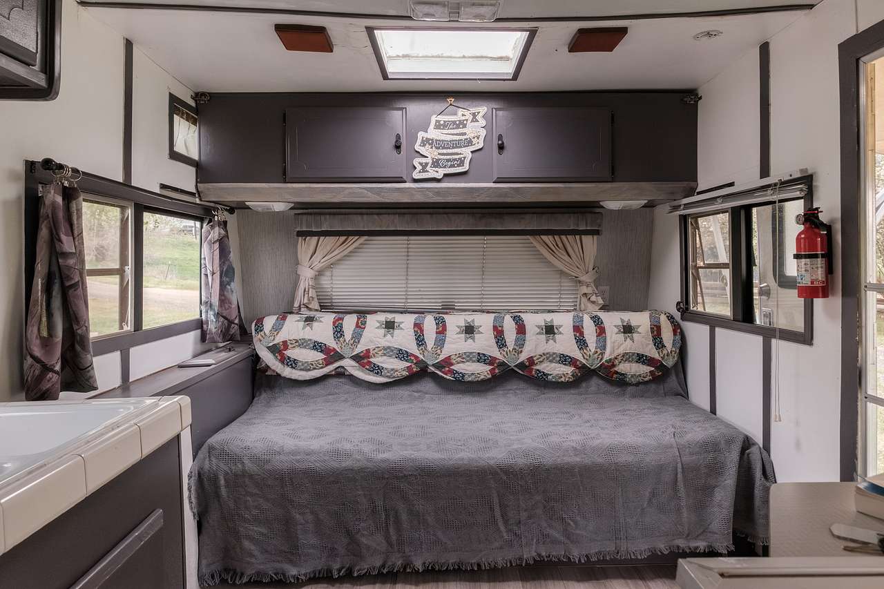 The couch turns into another double bed and the cabinets above fold out to create another bed.