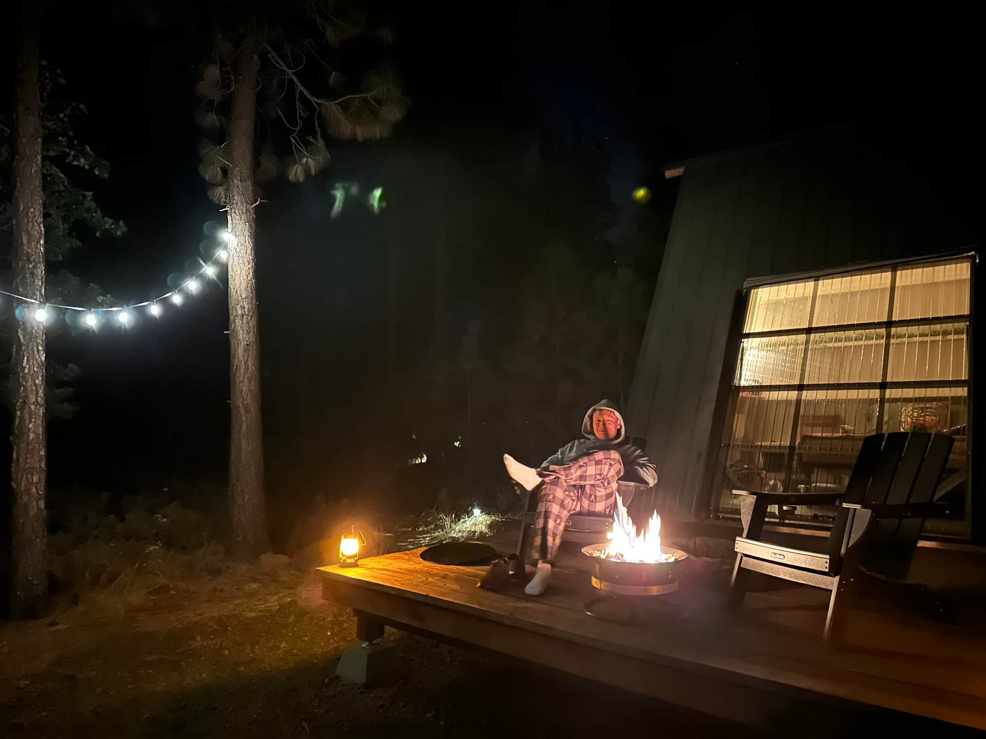 My husband enjoying the propane fire on the cabin porch. Such a cozy space! 