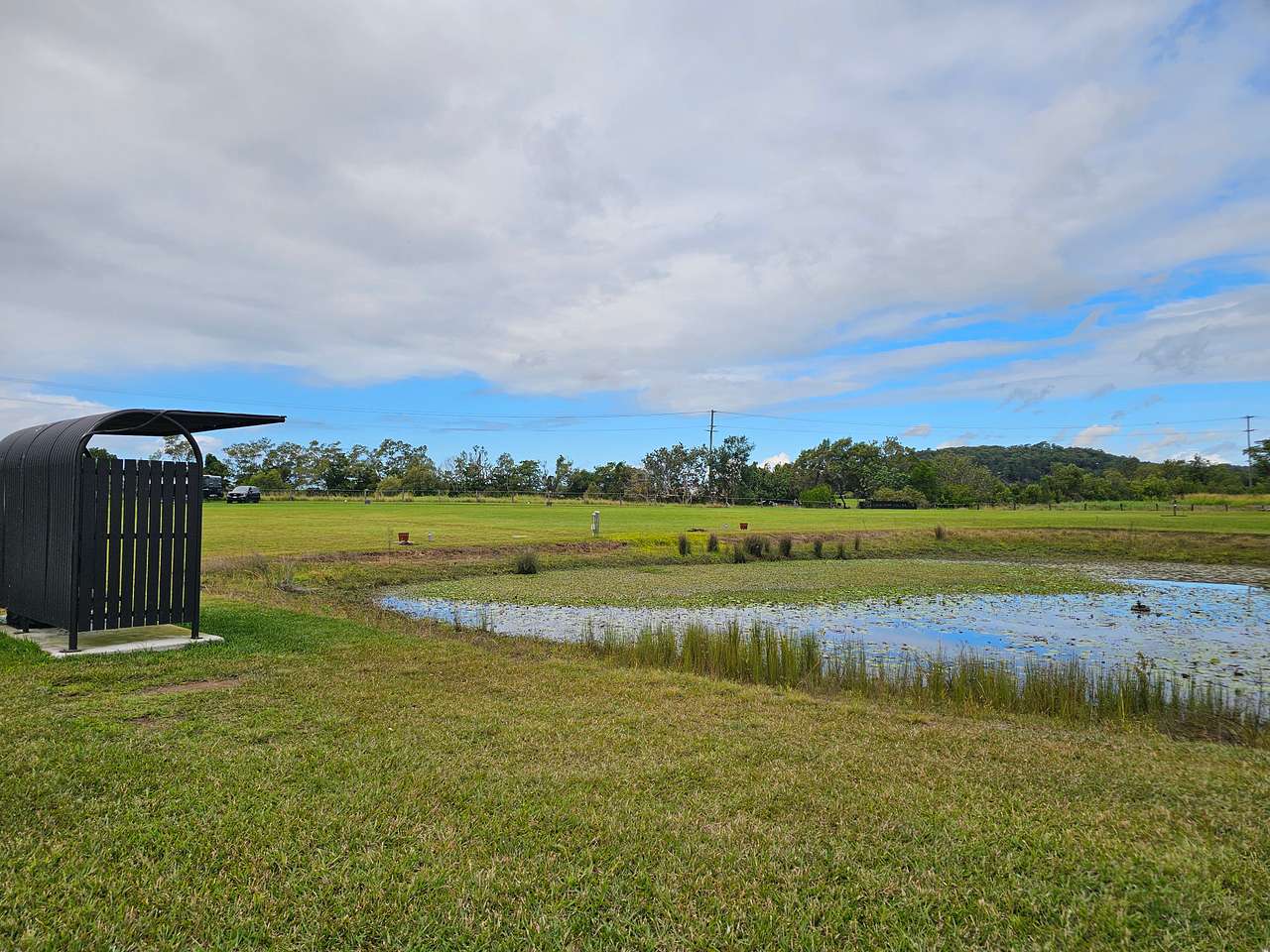 Site 5 is set next to the dam. This is an unpowered site. It is situated near the bus stop where firewood is stored for campers to purchase should they forget to bring firewood of their own. All sites have an onsite brazier for use during your stay. 