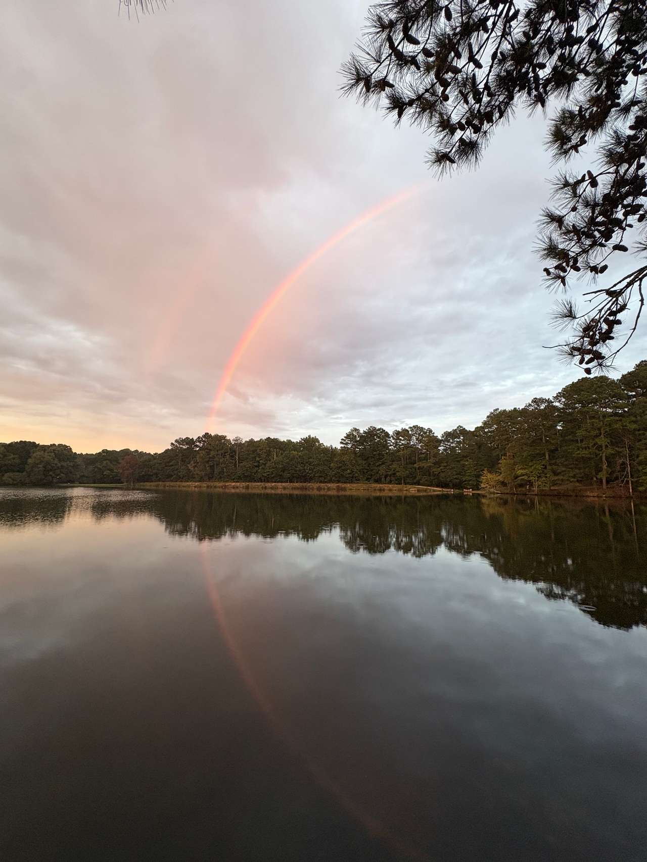 Double rainbow over the lake around sunset