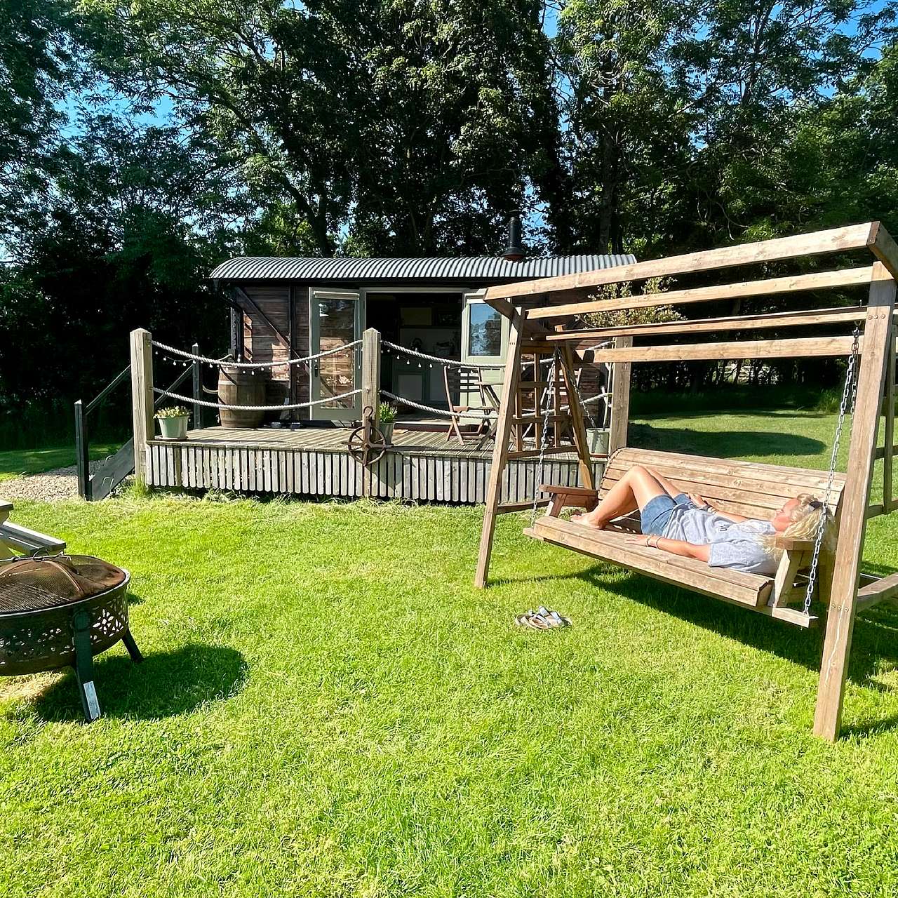 Victoria and the outside area with swing seat and BBQ.