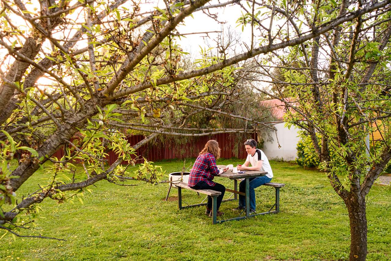 Private garden complete with a picnic table and fire pit
