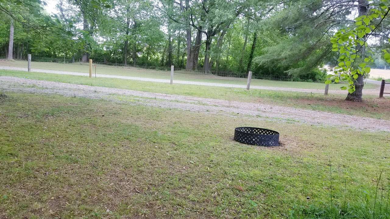 Rv spot #3 (45 ft) with fire pit for your use during your stay as well as complimentary firewood.  