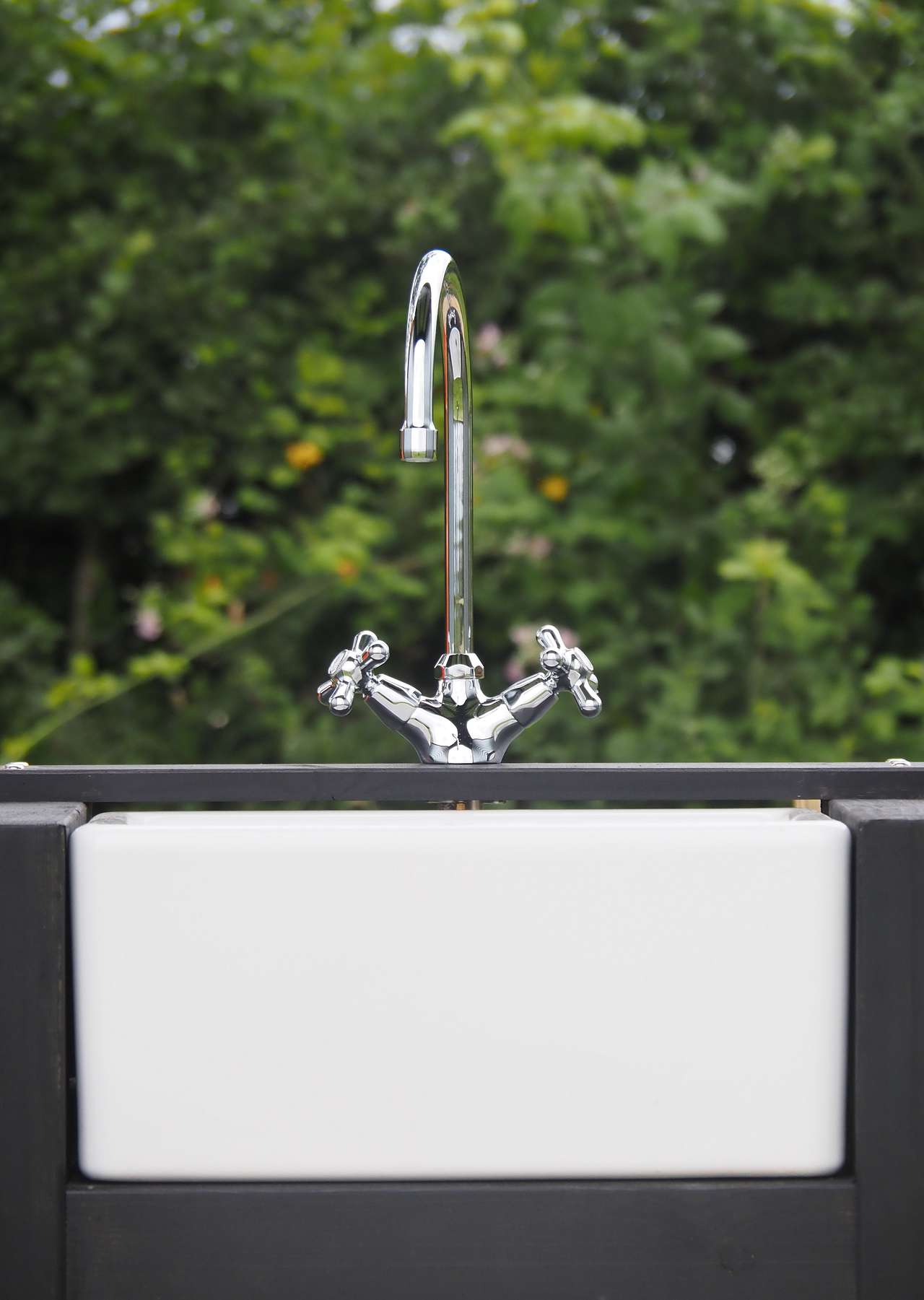 One of our off grid wash houses, providing a hot drench shower, a compost toilet and a beautiful ceramic vanity sink.