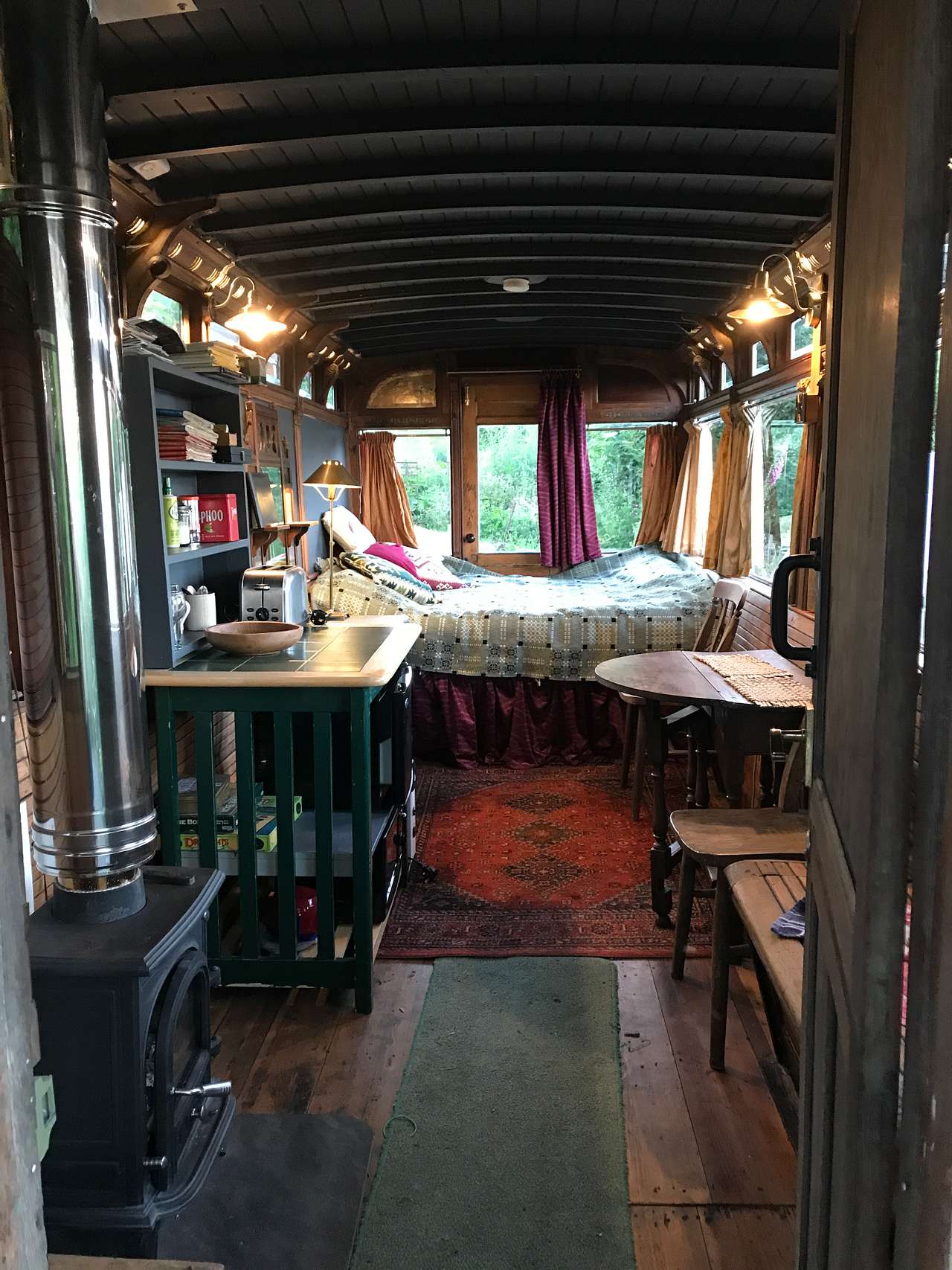 Inside Tram, comfy Bed, indoor seating/kitchen area, Silk Curtains, Historic  interior with opening quarter lights, LED lights behind Air Vents.