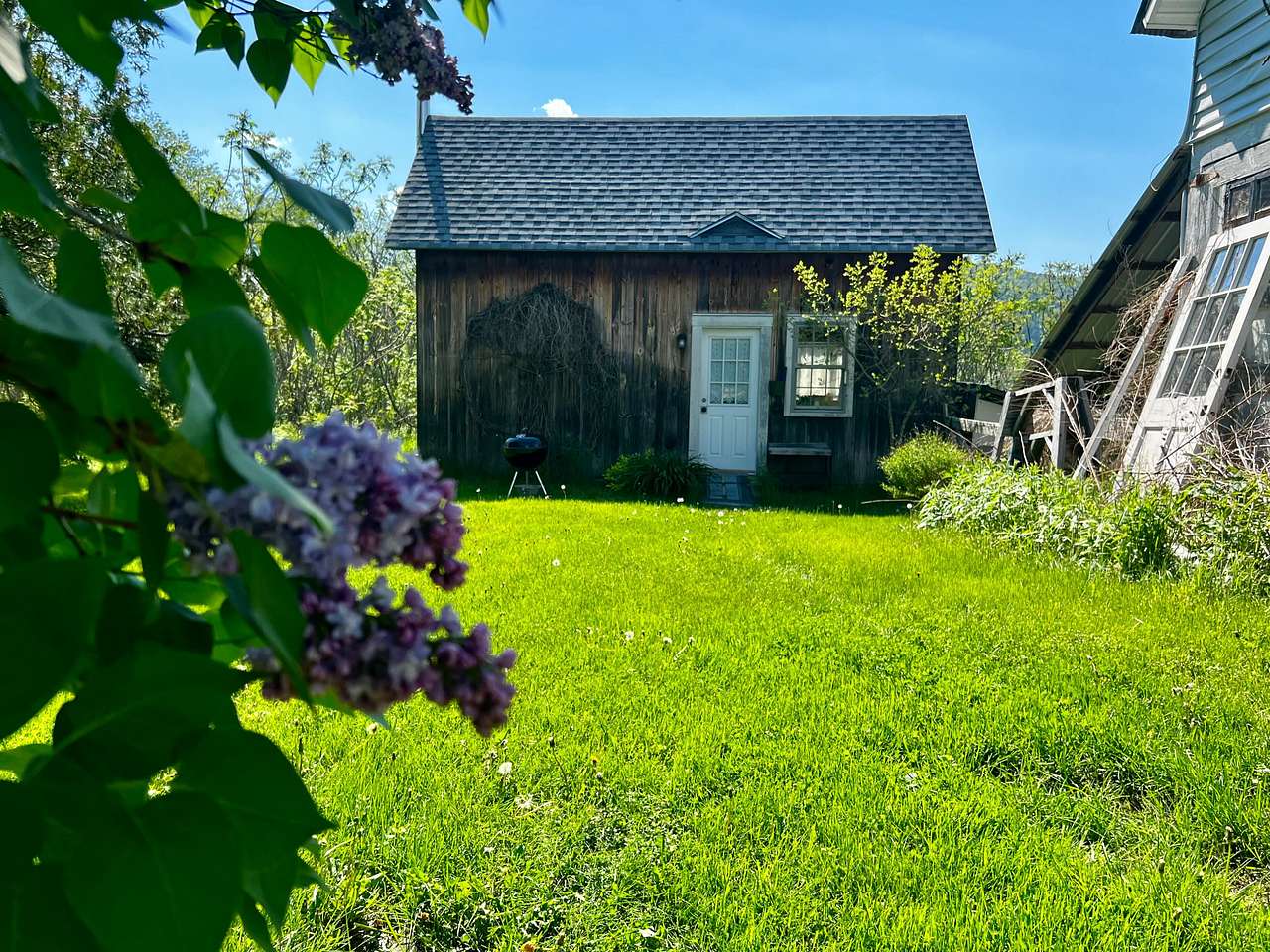 Tucked away from the main house behind a large lilac bush