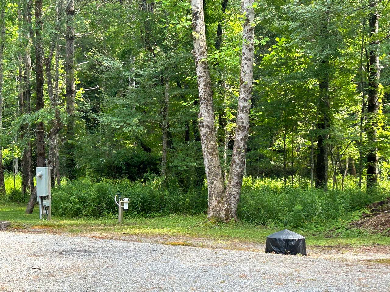 Level parking pad with all services easily accessible.