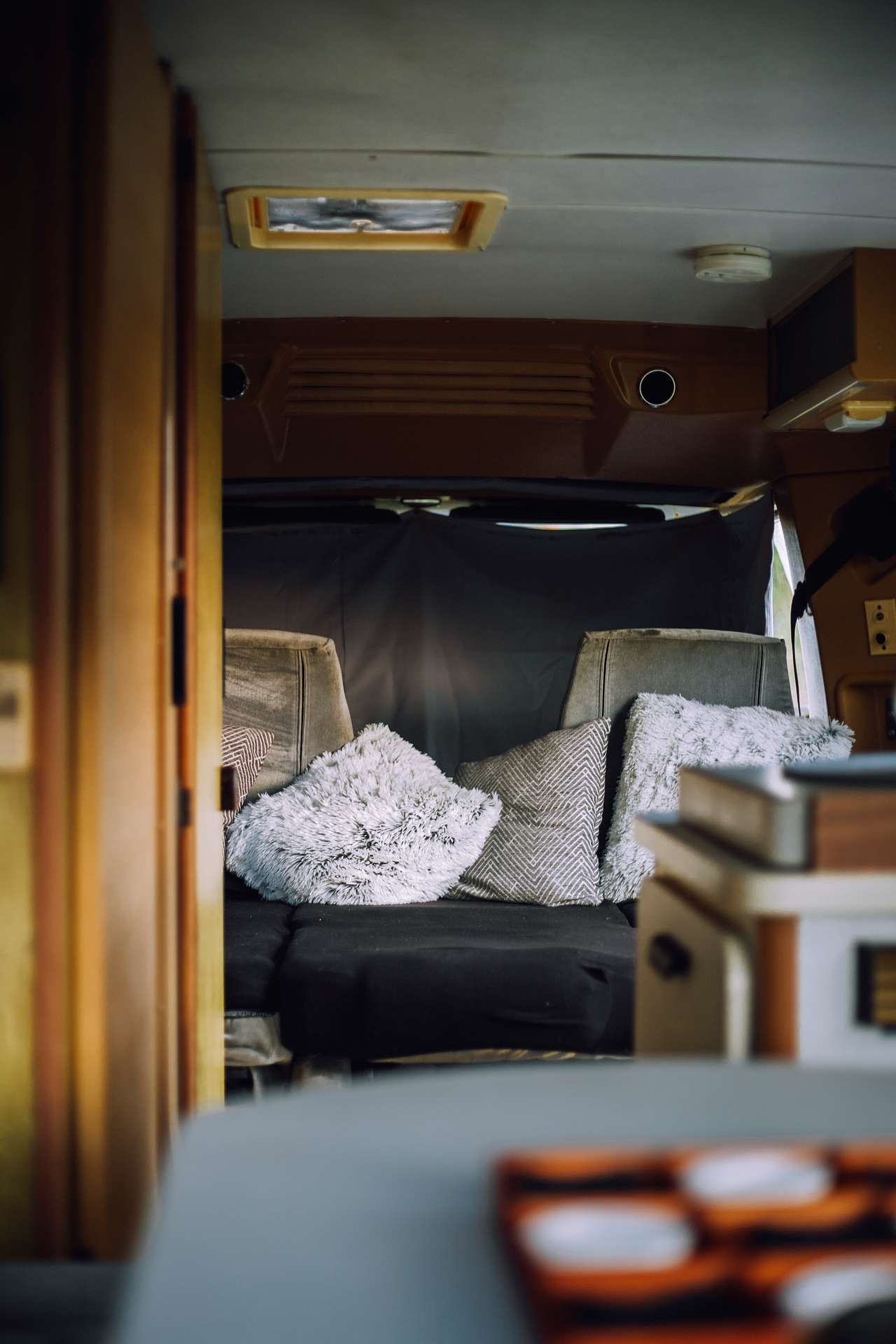 Minnie's front seats are folded down into a bed.