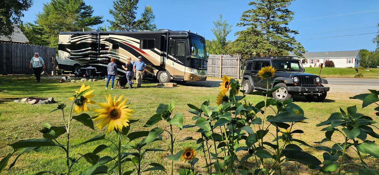 A motor coach sits on the pad at Ellie's RV spot.
