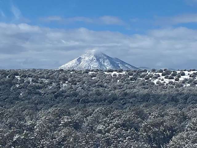 Picacho Butte elev. 7,168. 
approx. 6 miles away.
Peakbagger.com info. 
https://www.peakbagger.com/peak.aspx?pid=3934