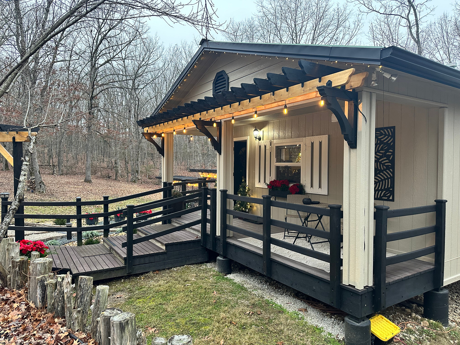The Front Porch of the Arbor Cabin, also showing steps.