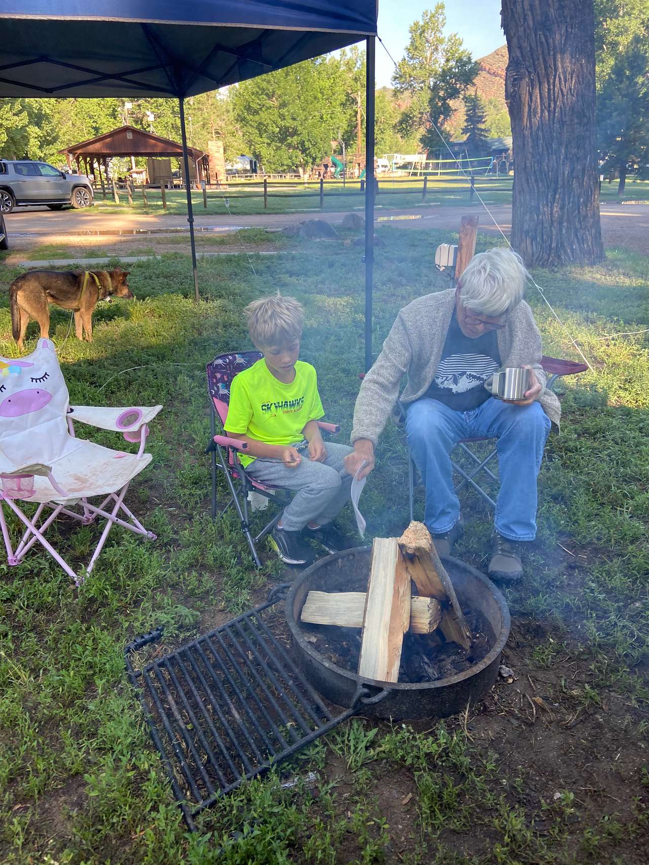 Teaching our grandson how to build a fire