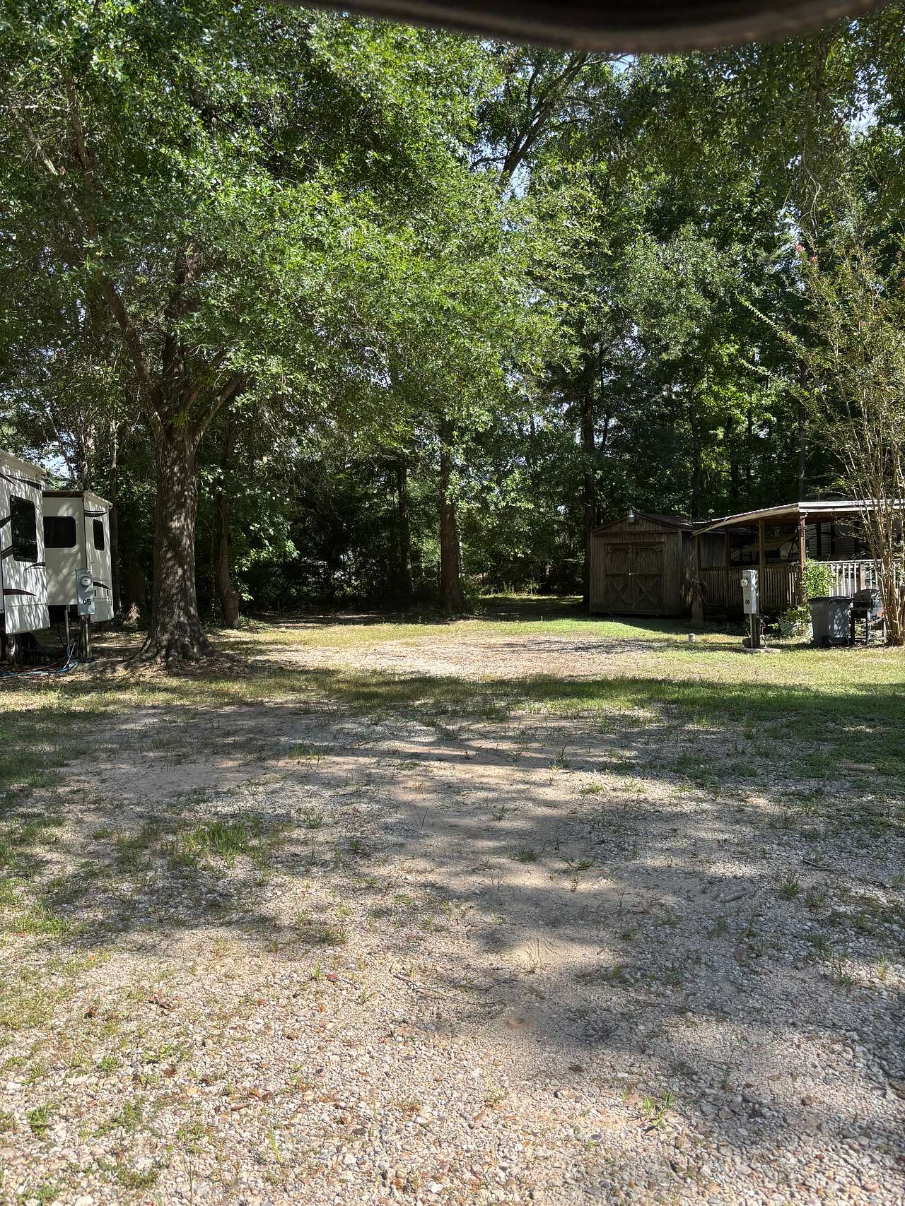 Site 8 gravel back in with trees as shade