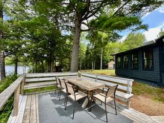 Outdoor eating with an outdoor bar b q. With plenty of seating.
