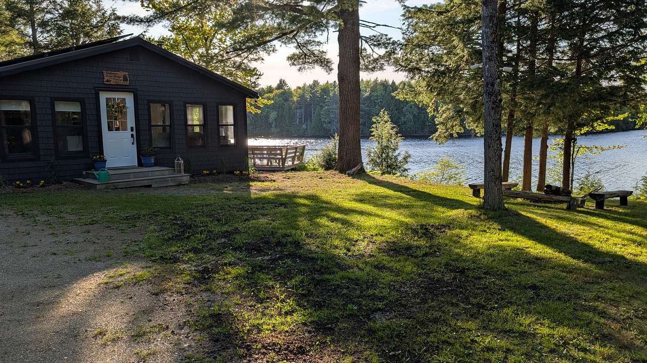 Front of cottage, in addition to a propane fire pit on the dock.  There is also a wood firepit to the right of the cottage. A firewood bundle gifted.