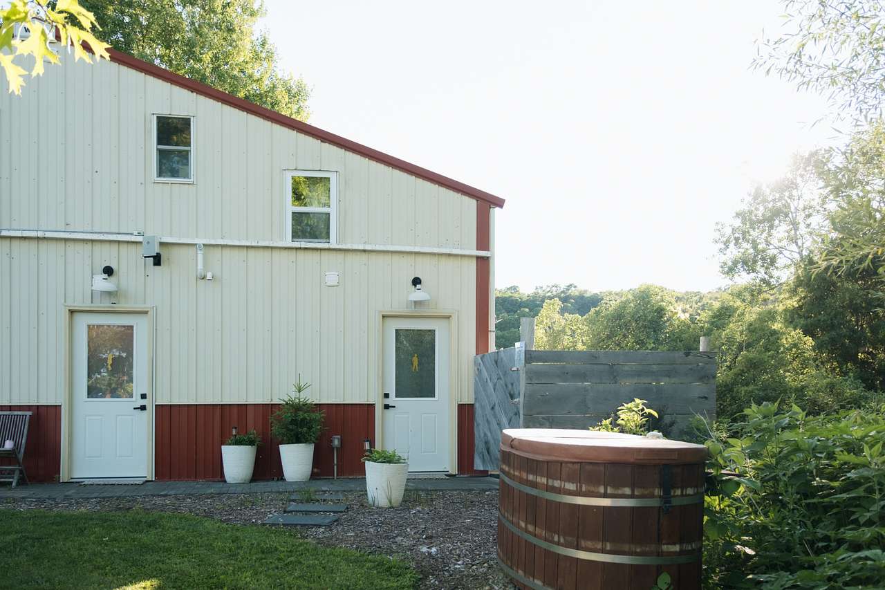 Restrooms, outdoor shower beyond the gate, and an outdoor tub soon to come.