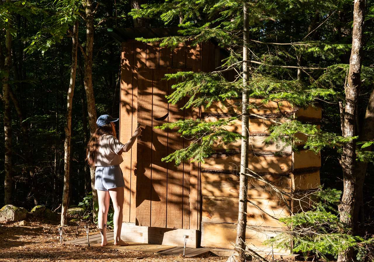 Outhouse with outdoor shower a few yards from the main tent