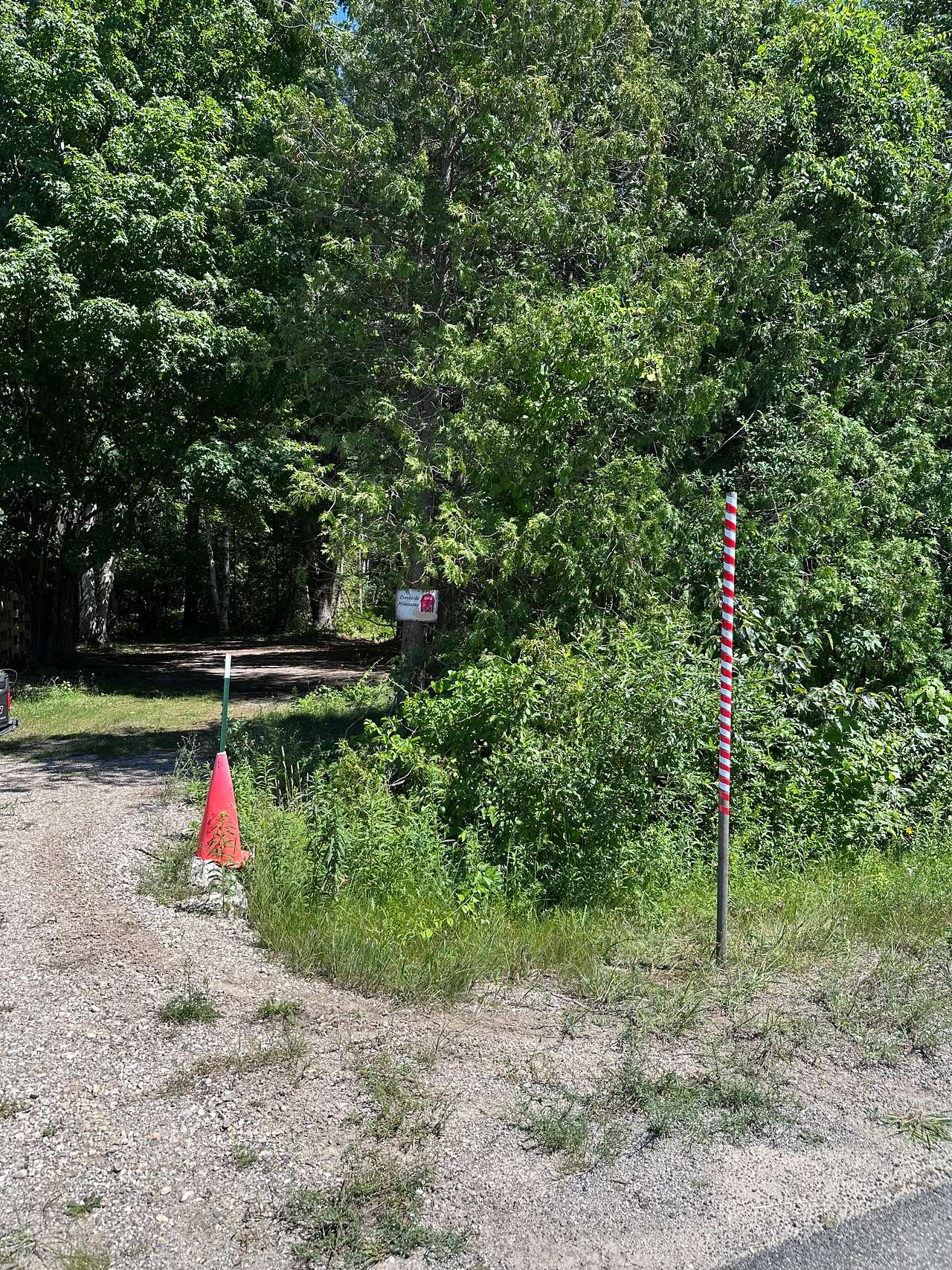 The red and white striped pole indicates the entrance to Creekside Hideaway